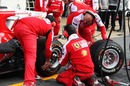 The Ferrari team practices pit stops