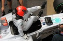 Michael Schumacher jumps from his Mercedes after Free Practice 2
