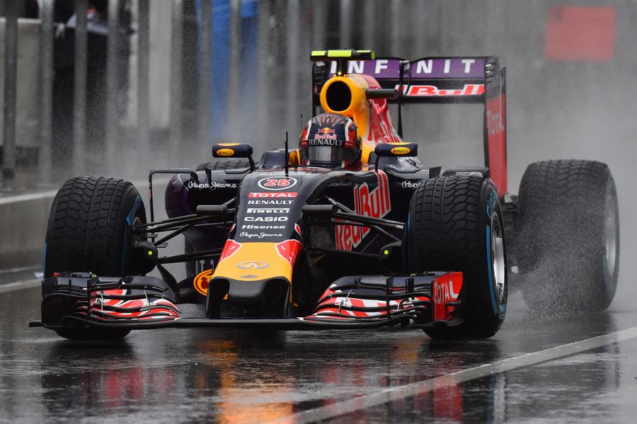 Daniil Kvyat makes his way down the pit lane in wet condition