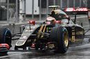 Pastor Maldonado makes his way down the pit lane in wet condition