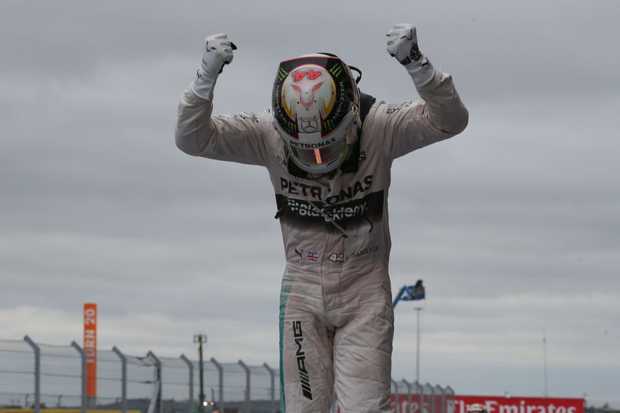 Lewis Hamilton celebrates his win and the third title