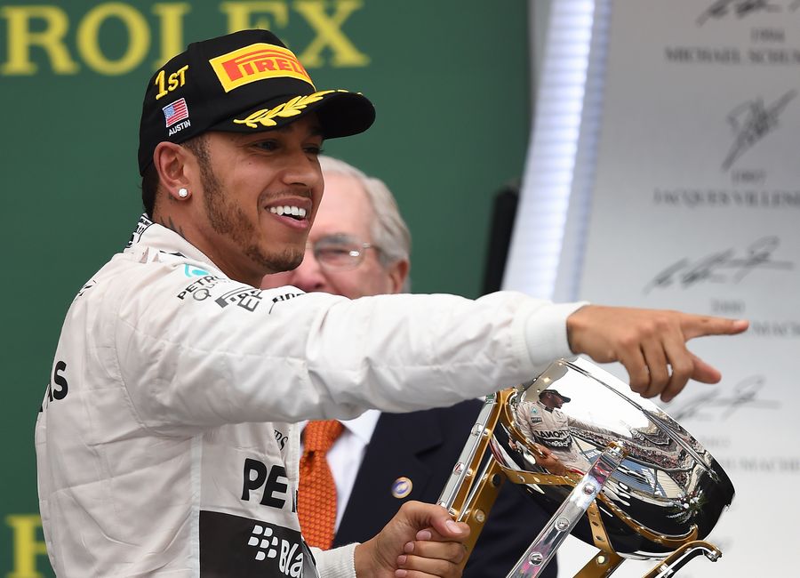Lewis Hamilton celebrates in the podium