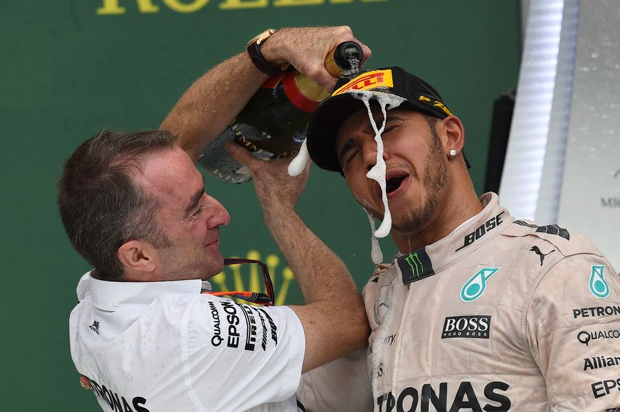 Paddy Lowe celebrates Lewis Hamilton with the champagne