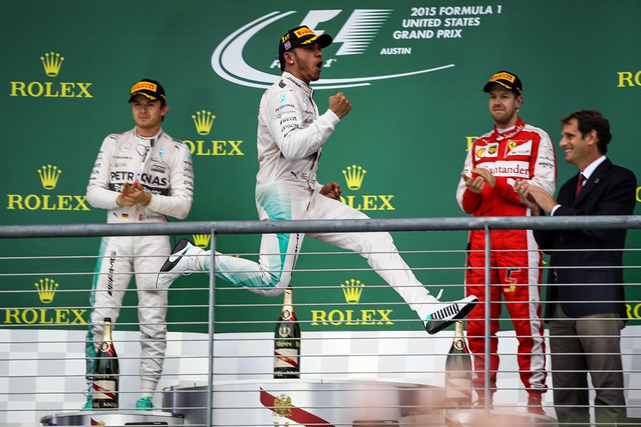 A delighted Lewis Hamilton jumps for joy