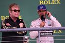 Elton John and Lewis Hamilton on the podium