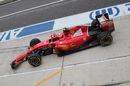 Kimi Raikkonen returns to the pit with broken front wing after his crash