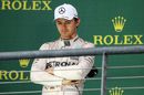 Nico Rosberg looks on from the podium