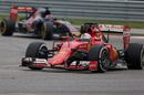 Sebastian Vettel leads Max Verstappen