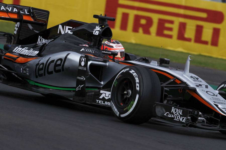 Nico Hulkenberg cranks on the steering lock in the Force India