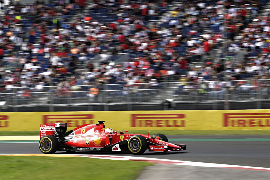 Sebastian Vettel speeds past the grandstand