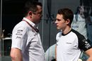 Stoffel Vandoorne talks with Eric Boullier at the paddock