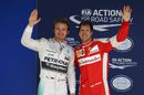 Nico Rosberg and Sebastian Vettel pose for a picture after qualifying