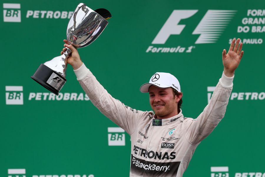 Nico Rosberg celebrates his win with trophy