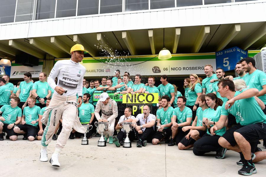 Nico Rosberg and Lewis Hamilton celebrates with Mercedes