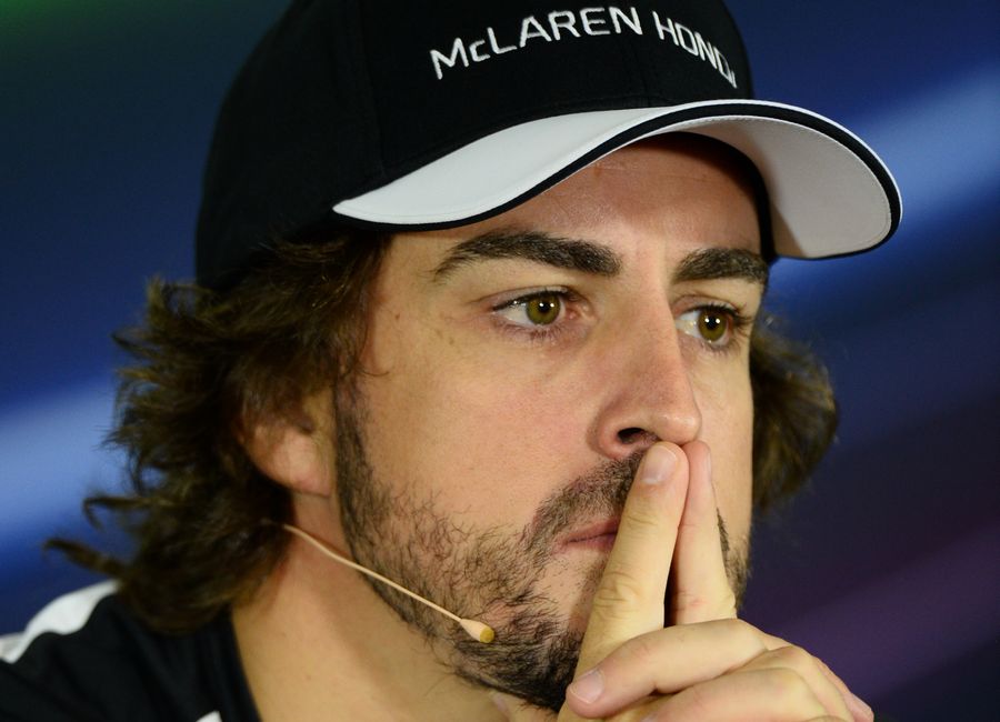 Fernando Alonso looks on the Thursday press conference