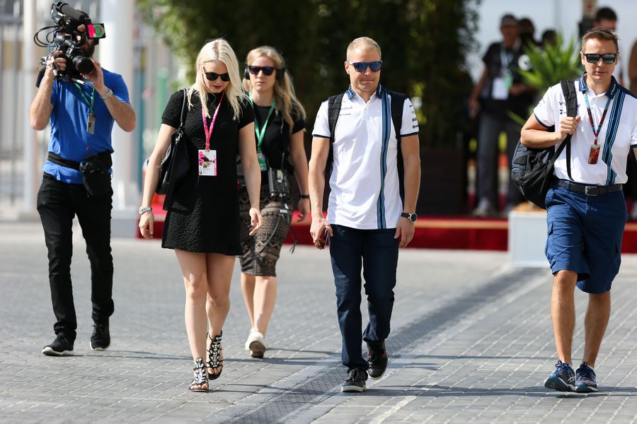 Valtteri Bottas arrives at the paddock with his girlfriend Emilia Pikkarainen