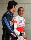 Mark Webber shares a joke with Lewis Hamilton after taking pole