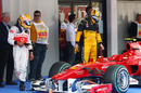 Lewis Hamilton and Robert Kubica check out a rival Ferrari