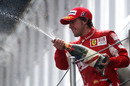 Fernando Alonso celebrates second on the podium