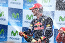 Mark Webber celebrates on the podium