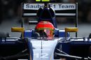 Felipe Nasr cranks on the steering lock in the Sauber