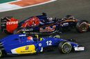 Max Verstappen and Felipe Nasr battle for a position