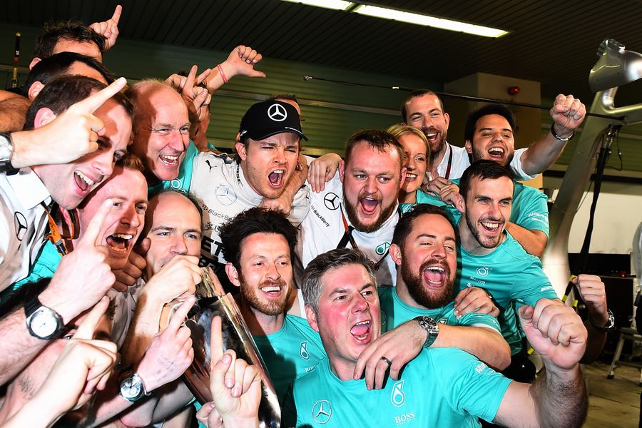 Nico Rosberg celebrates with Mercedes members