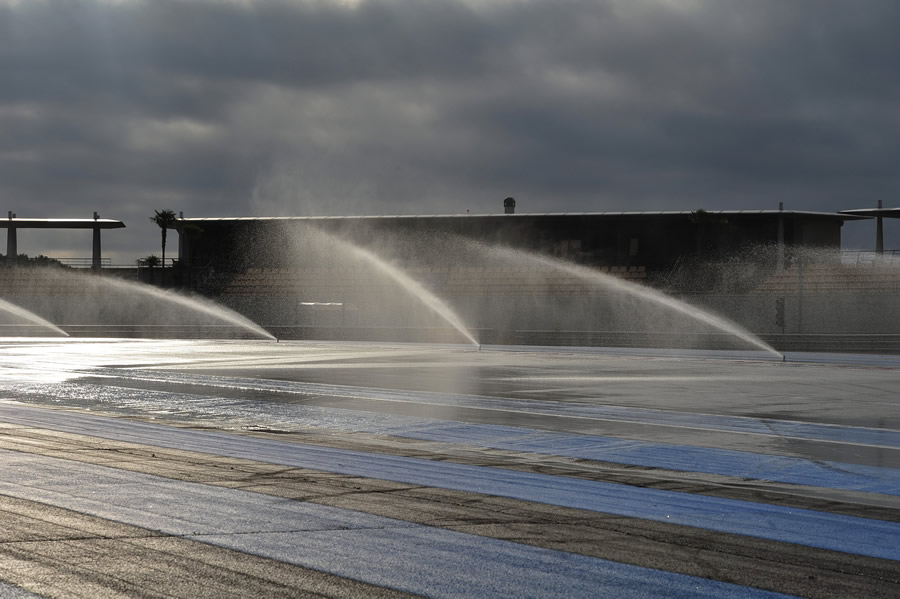 Sprinklers wet the track for wet weather testing