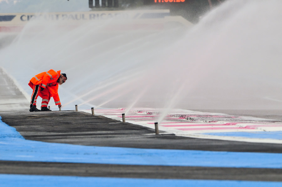 Sprinklers wet the track for wet weather testing