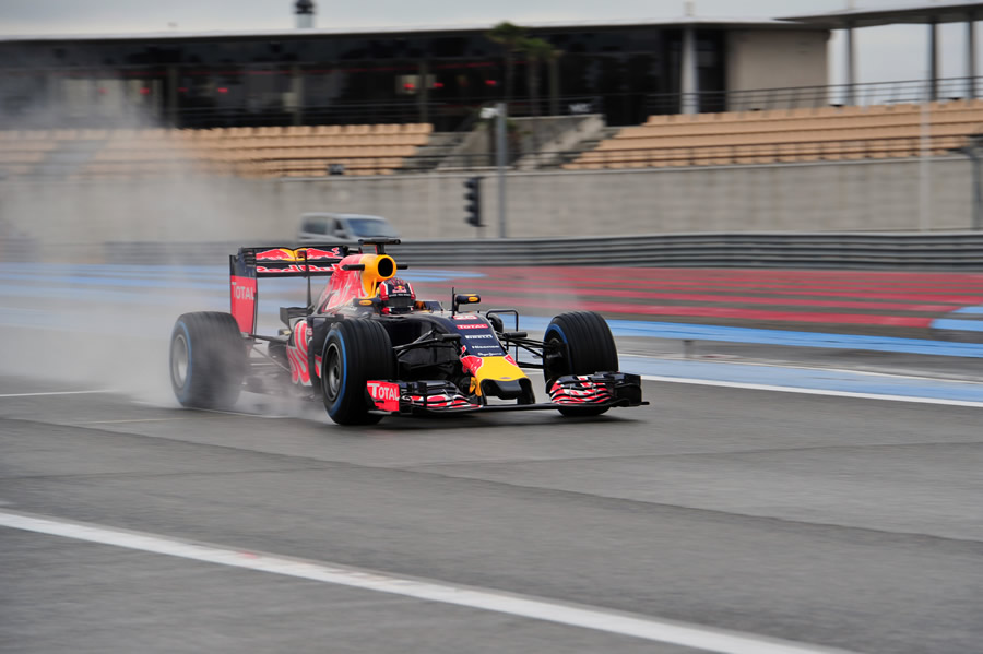 Daniil Kvyat drives on the wet track