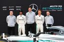 Mercedes drivers and team members pose with the Mercedes-Benz F1 W07 Hybrid