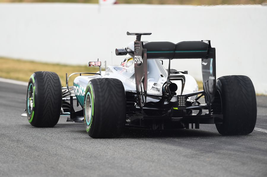 Lewis Hamilton makes his way down the pit lane