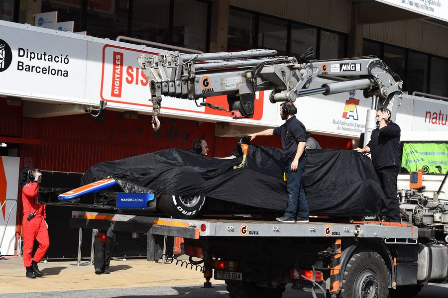Rio Haryanto's MRT05 is recovered to the pits