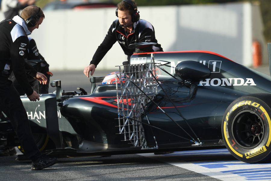 Jenson Button returns to the pit after the run with aero sensors 