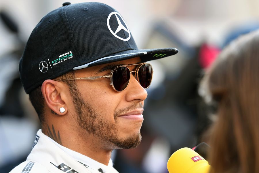 Lewis Hamilton talks with media