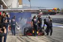 Daniil Kvyat  returns from one of his morning runs with a rear brake on fire