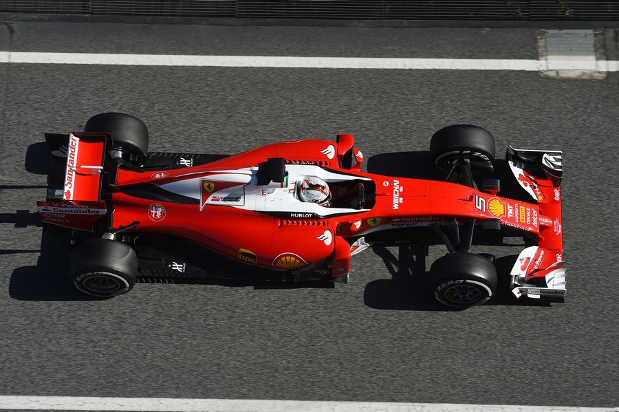 Sebastian Vettel makes his way down the pit lane