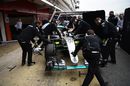 Lewis Hamilton behind Mercedes garage screens as he returns to the pit