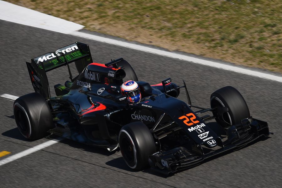 Jenson Button on track in the MP4-31 with aero paint on the rear