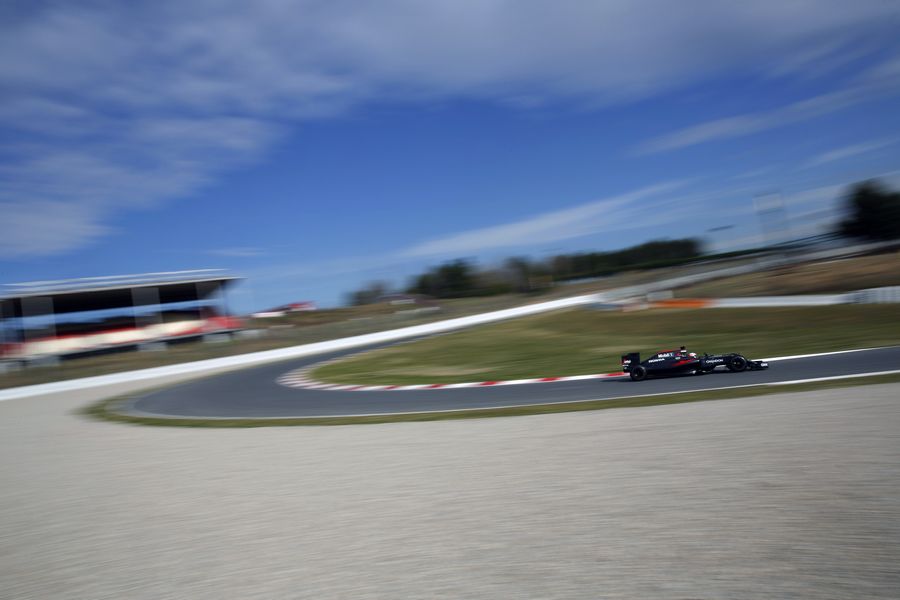 Jenson Button at speed in the McLaren MP4-31