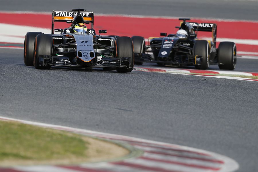 Sergio Perez in the VJM09 leads Kevin Magnussen in the Renault RS16