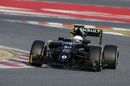 Kevin Magnussen rides the kerbs