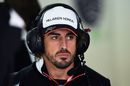 Fernando Alonso watches the test session from the McLaren garage