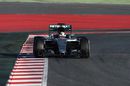 Lewis Hamilton rides the kerb in the Mercedes