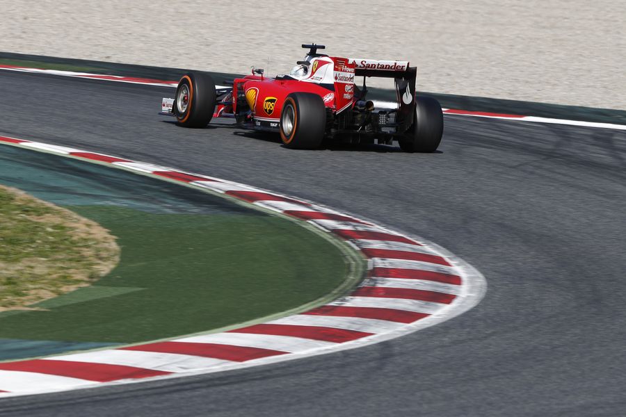 Sebastian Vettel guides the Ferrari through a corner