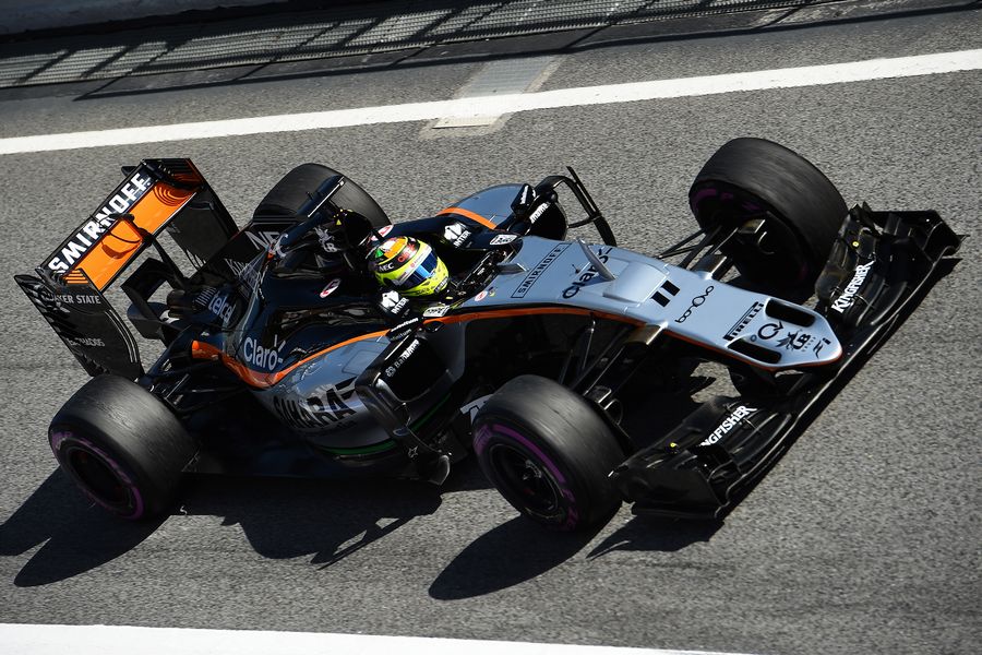 Sergio Perez makes his way down the pit lane