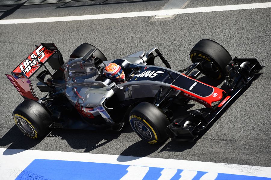Romain Grosjean makes his way down the pit lane