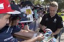 Kevin Magnussen signs autographs for the fans