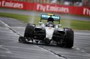 Nico Rosberg aims for the pit with broken front wing