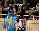 Fernando Alonso celebrates with fans during the Monaco All Stars soccer match